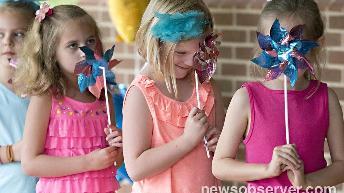 From left, Hollis Finch, 6, Kaitlyn Hill, 6, Grace Draminski, 7, and Bennett Kracht, 7, dance during The Quest Academy charter school’s end of year showcase Thursday, June 2, 2016, in Raleigh, N.C.