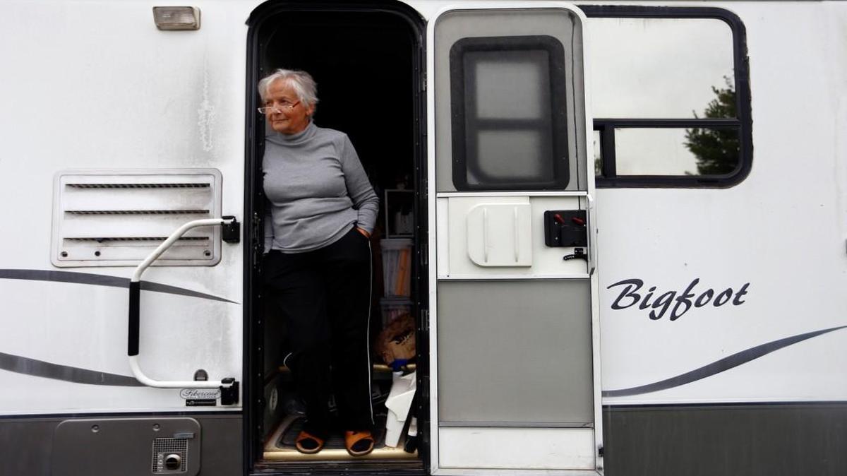 Dolores Westfall, 79, stands in the doorway of her motor home she calls Big Foot at the Darien Lake theme park camp site in September in upstate New York. The roof leaks, as does the pipes beneath the kitchen sink. Her generator and water pump are failing. Dolores worked overtime all summer to fund repairs, yet the $500 extra dollars were gone, spent on necessities like a pair of sturdy work shoes and a rain parka. Yet she maintains a positive attitude.