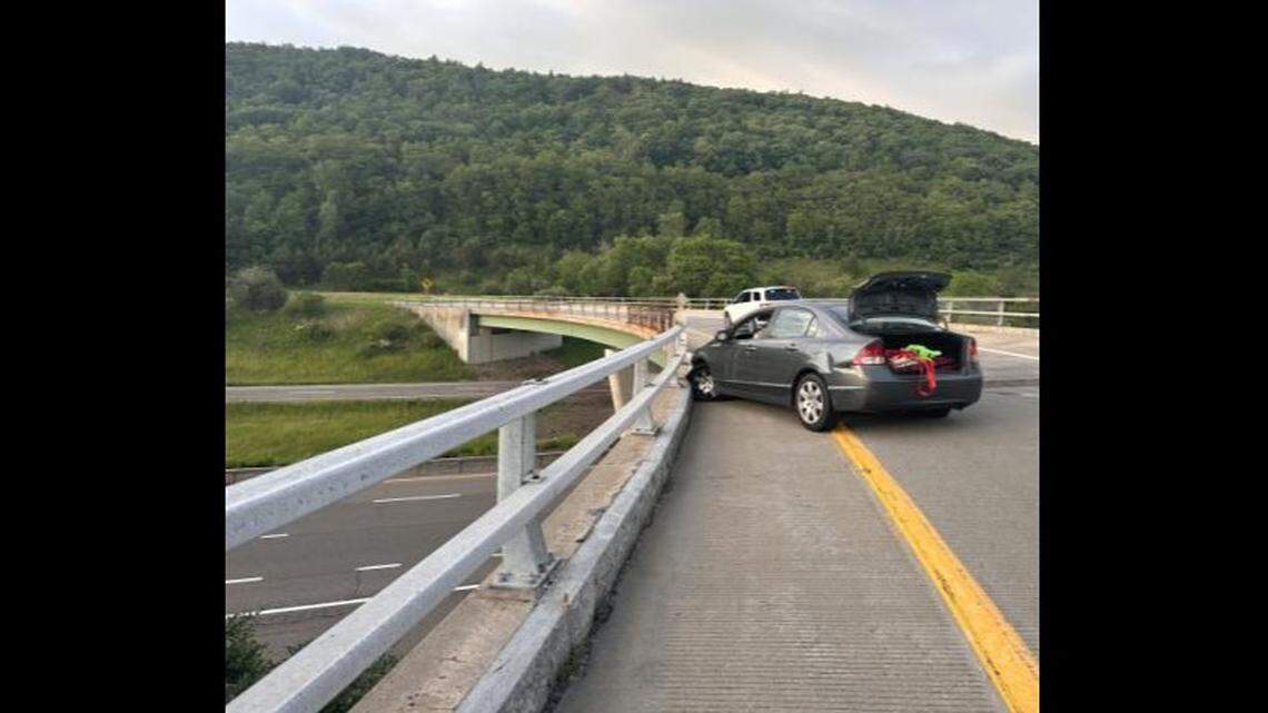 A triple-homicide suspect from Virginia crashed her car during a police chase in New York and was taken into custody, authorities said.