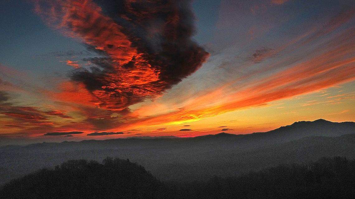 A brilliant sunset over Blowing Rock, N.C. with Grandfather Mountain silhouetted in the background on Saturday, Nov. 25, 2017.