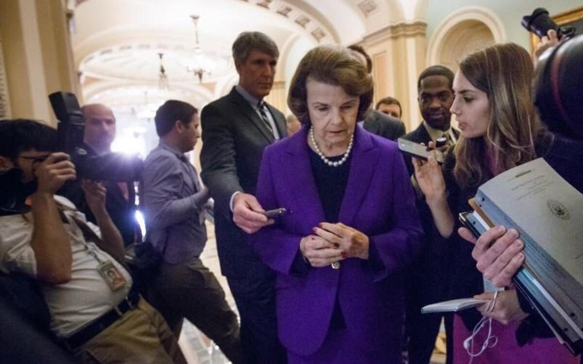 Former Senate Intelligence Committee Chairwoman Dianne Feinstein, is surrounded by reporters on Capitol Hill last December after releasing a report on the CIA’s harsh interrogation techniques at secret overseas facilities.