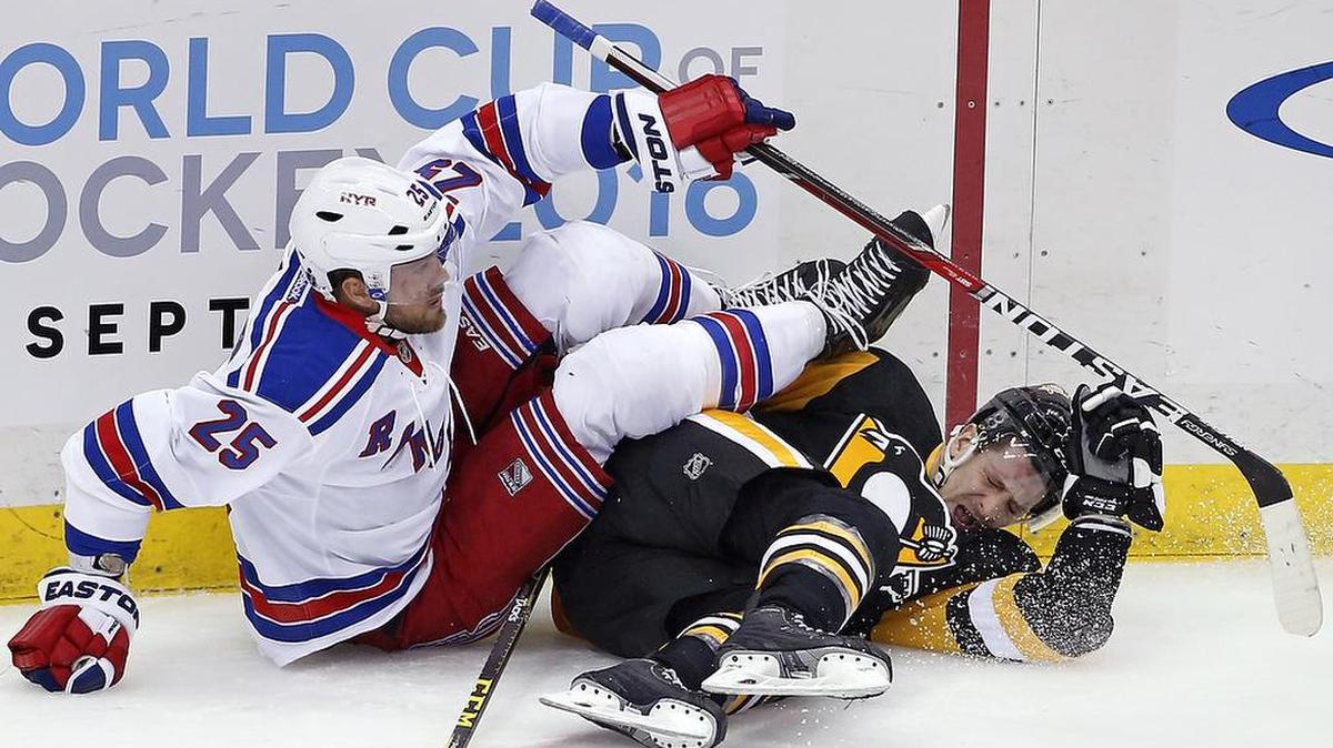 New York Rangers' Viktor Stalberg (25) collides with Pittsburgh Penguins' Kevin Porter (11) during the first period of an NHL hockey game in Pittsburgh, Thursday, March 3, 2016. Porter was injured on the play and left the game.