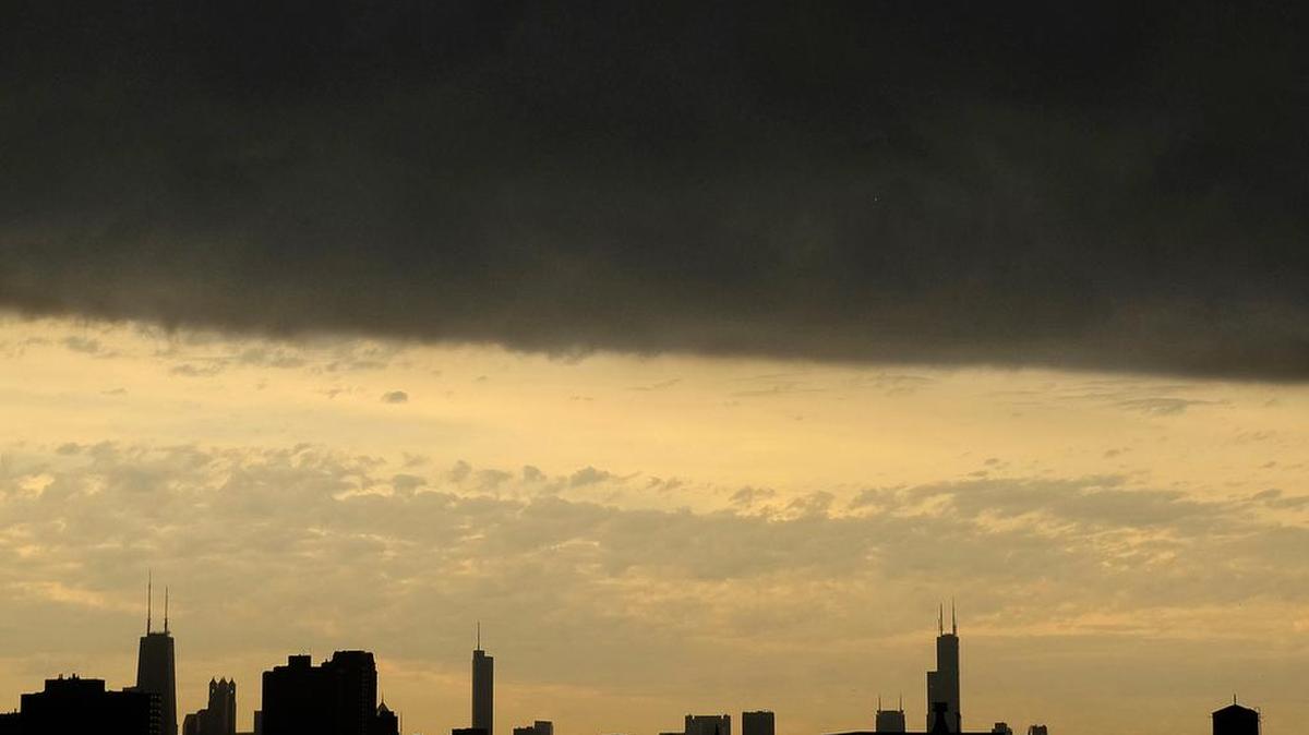 Dark clouds cover the downtown Chicago skyline as stormy weather approaches in this Wednesday, Sept. 21, 2016, file photo.