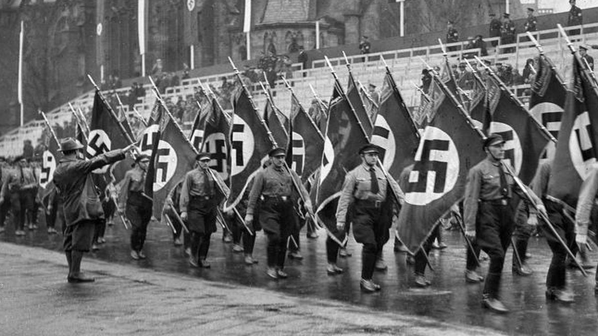 
A picture dated in 1935 shows German Nazi’s parading down a street. In Germany, where the swastika elicits Adolf Hitler’s final solution and the systematic murder of six million Jews and 5 million others, Nazi symbols are rarely seen today. The conquering allies banned their display in October 1945; the new Federal Republic of Germany enshrined that ban in German law in 1949. 
