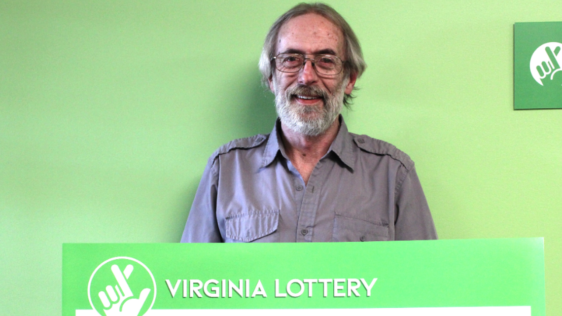 Keith Carr couldn’t stop looking at his winning lottery ticket.