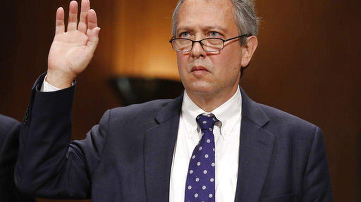 FILE - In this Sept. 20, 2017, file photo, Thomas Farr is sworn in during a Senate Judiciary Committee hearing on his nomination to be a District Judge on the United States District Court for the Eastern District of North Carolina, on Capitol Hill in Washington.
