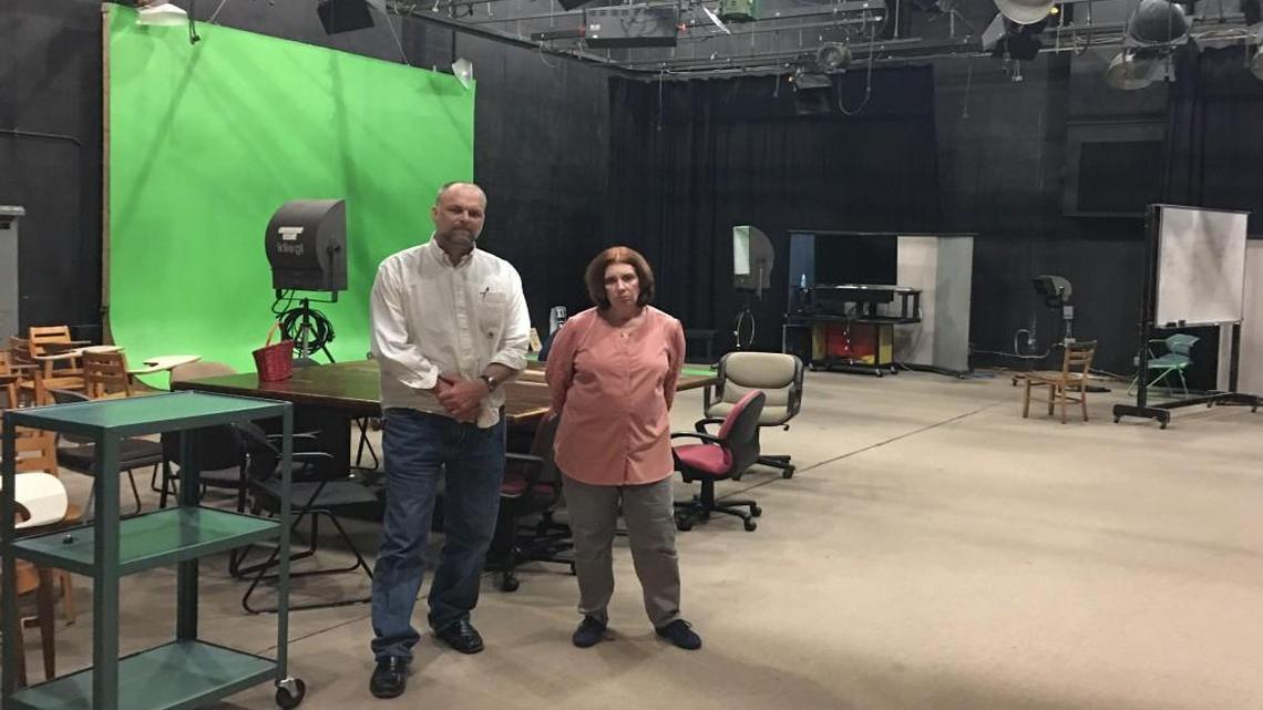 UNC-Chapel Hill professors Mark Robinson and Cori Dauber stand in an empty studio in Swain Hall. They had hoped to use a federal grant to fill the space with students developing multimedia to fight extremist groups.