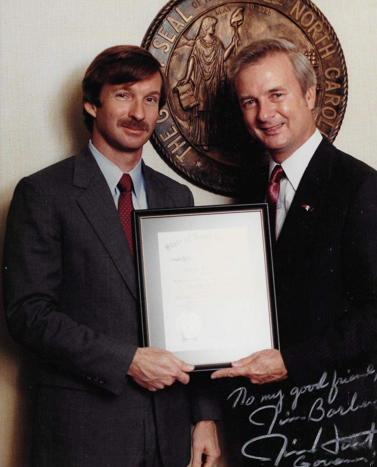 Jim Barber, left, receives the Order of the Longleaf Pine from then-Gov. Jim Hunt in 1985. At the time, Barber was controller for the N.C. Board of Education. Barber is now retired after working in state government for 30 years.