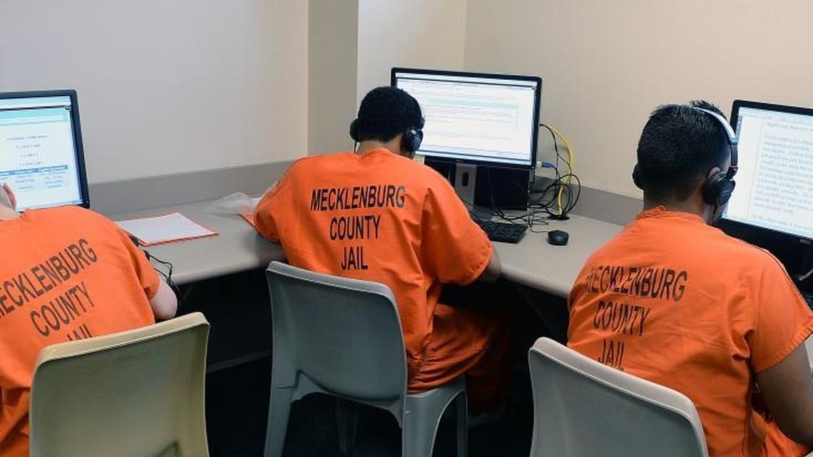 Inmates sit at computers studying for their GED at the Mecklenburg County Jail.