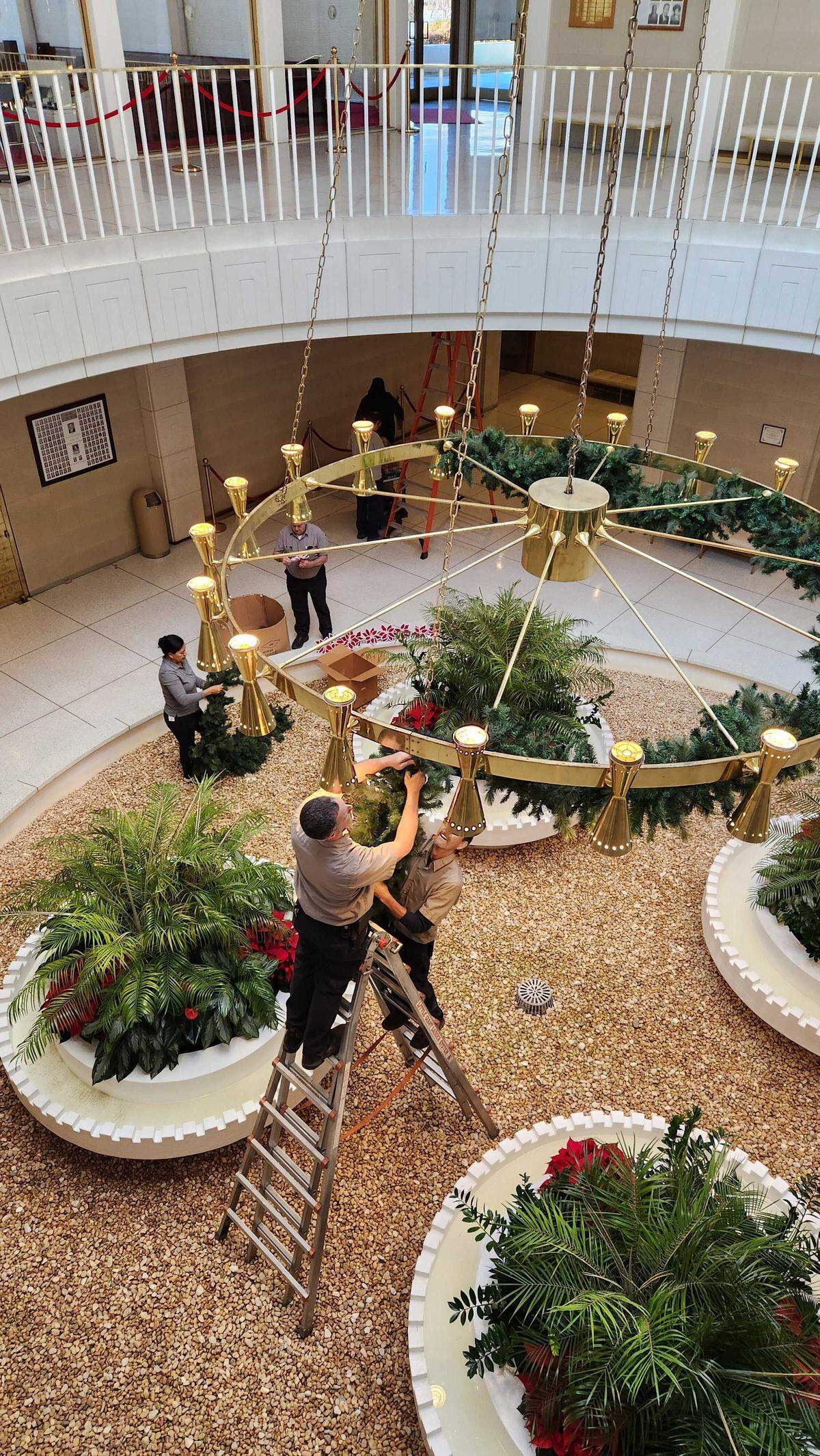 General Assembly staff decorate the rotunda at the North Carolina Legislative Building in Raleigh on Dec. 3, 2025.