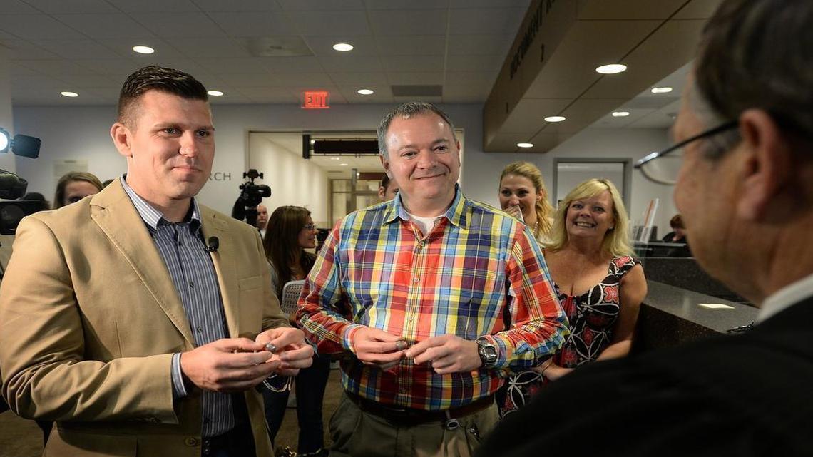 
Chad Biggs, left, and Chris Creech say their wedding vows in front of Wake County magistrate Dexter Williams in October. The N.C. House will consider a bill to exempt magistrates from performing weddings.
