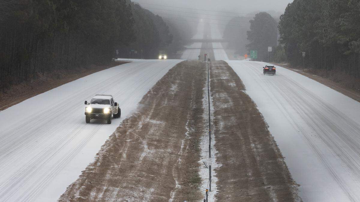 Vehicles slowing make their way east and west on US 64 in Apex on Sunday morning, Jan. 25, 2026.