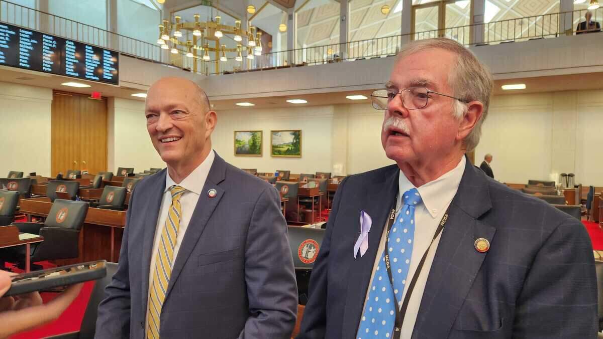 Republican Rep. Dean Arp, left, and Republican Rep. Donny Lambeth, right, are two of the North Carolina House’s longtime top budget writers. They talked with reporters after a House voting session on June 17, 2026.