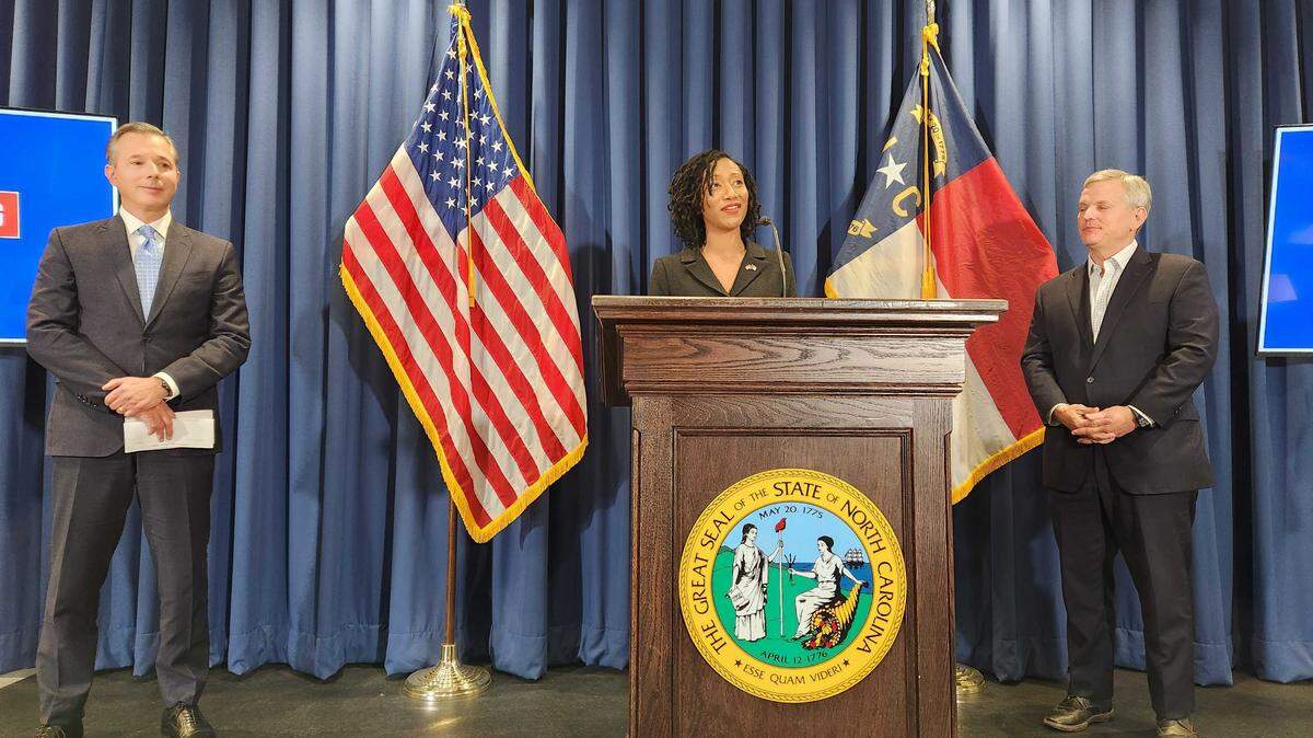 N.C. Department of Military and Veterans Affairs Secretary Jocelyn Mitnaul Mallette, at podium, talks to reporters during a news conference on Monday, Oct. 20, 2025 at the Albemarle Building in Raleigh, N.C.