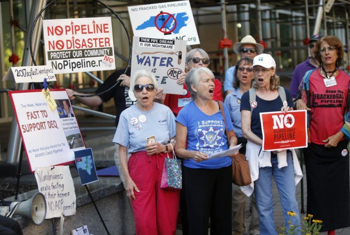 The Raging Grannies, minus their costumes, sing as they join protesters Sept. 13, 2017, around lunchtime to try to convince the N.C. Department of Environmental Quality to not approve permits that would allow the natural gas Atlantic Coast Pipeline to be built. They all were in front of the DEQ offices in downtown Raleigh on Sept. 13, 2017.