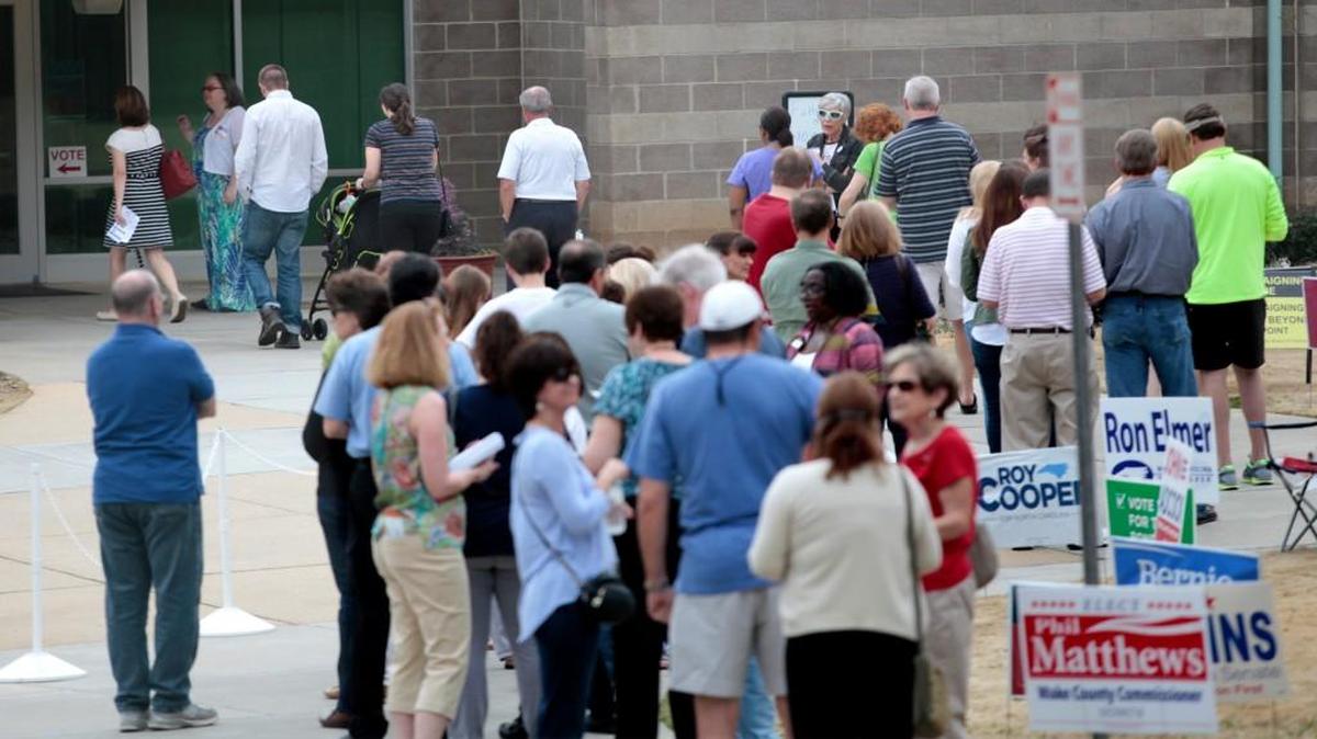 Wake County voters waited in line to vote at the Lake Lynn Community Center in north Raleigh early voting site in Raleigh on Friday, March 11, 2016. At back left, voting officials let in four voters at a time to keep the inside lines filled.