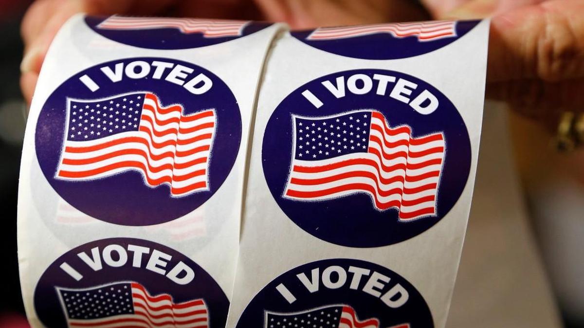 Voters are offered a sticker as they cast their ballots as hundreds came out on the first day of early voting at the Hope Mills Recreation Center in Hope Mills, NC on Oct. 20, 2016. An early voting site in Granville County was left unlocked on Saturday, and election materials and completed ballots weren’t properly secured.