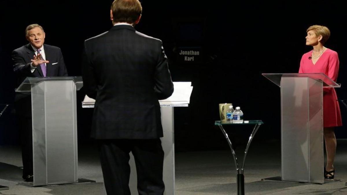 U.S. Sen. Richard Burr, R-N.C., left, and Democratic challenger Deborah Ross participate in a live televised debate hosted by Jonathan Karl of ABC News at UNC-TV studios in Research Triangle Park, N.C., Thursday, Oct. 13, 2016. (AP Photo/Gerry Broome, Pool)