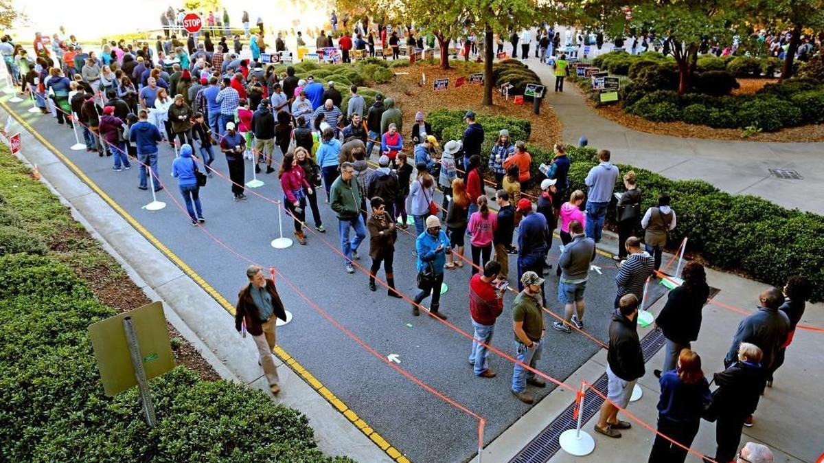 Folks wait in line for the final day of early voting at the Herbert C. Young Community Center in Cary, N.C. on Saturday, Nov. 5, 2016.