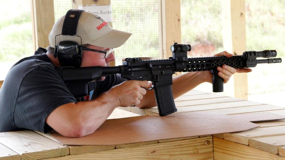 Shooting enthusiast Jamie Wells from Franklinton takes aim with his AR-15 rifle at the new shooting range at the Caswell Game Lands near Yanceyville in Caswell County on Sept. 11, 2014.