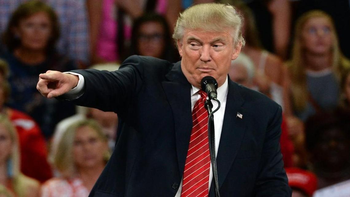 Republican presidential candidate Donald Trump points to a member of the audience as he makes remarks at the Trask Coliseum on the campus of UNC-W in Wilmington, N.C. Tuesday, August 9, 2016.