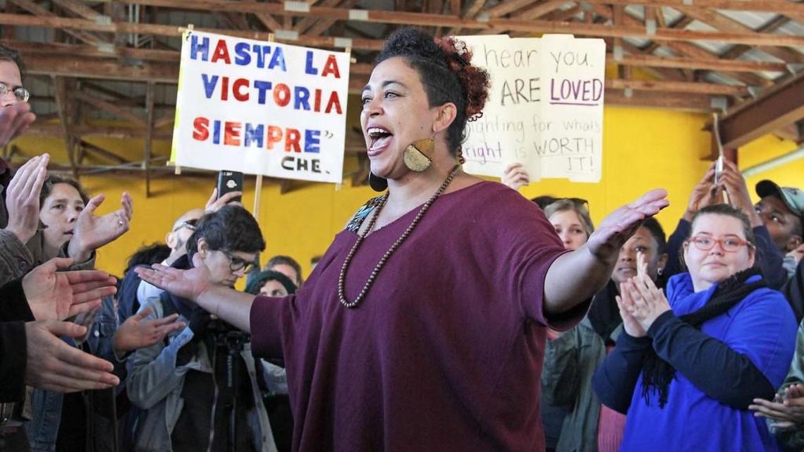Serena Sebring of Southerners on New Ground, pumps up the crowd. Between 300 and 400 people attended a Durham in Defiance rally in response to the election, in Durham Central Park on Sunday, Nov. 13, 2016. The four hour rally was divided into parts, in which participants were encouraged to focus on a sense of belonging, full and ferocious love, anger and rage, and leadership and responsibility.