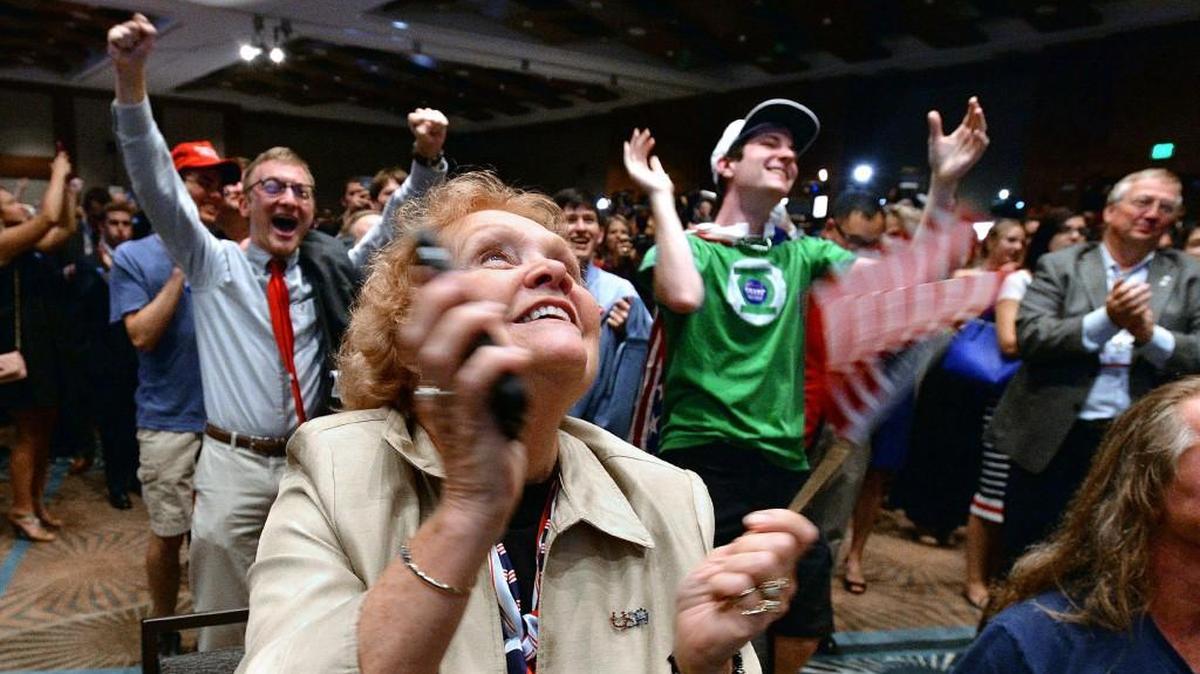 Lyn Thrasher reacts with the crowd as North Carolina turns Red with Donald Trump being declared the winner at the Crabtree Marriott in Raleigh, N.C. Tuesday, Nov.8, 2016.
