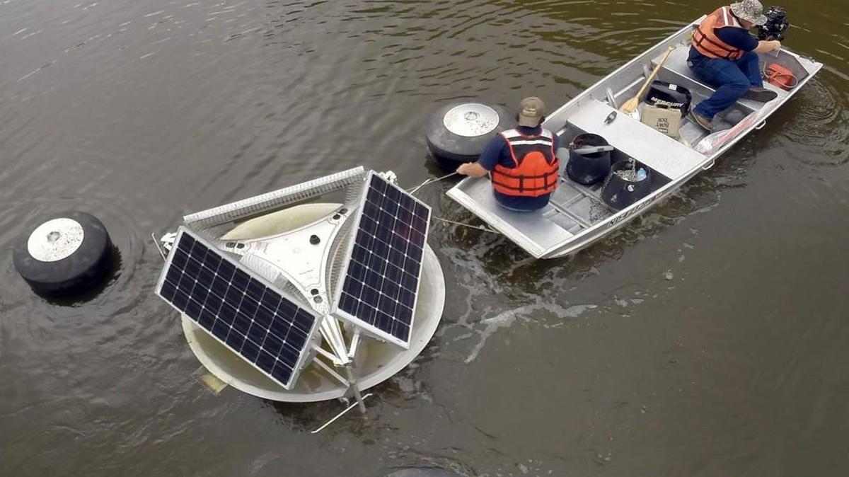 A SolarBee unit is transported to Jordan Lake on July 22, 2014.