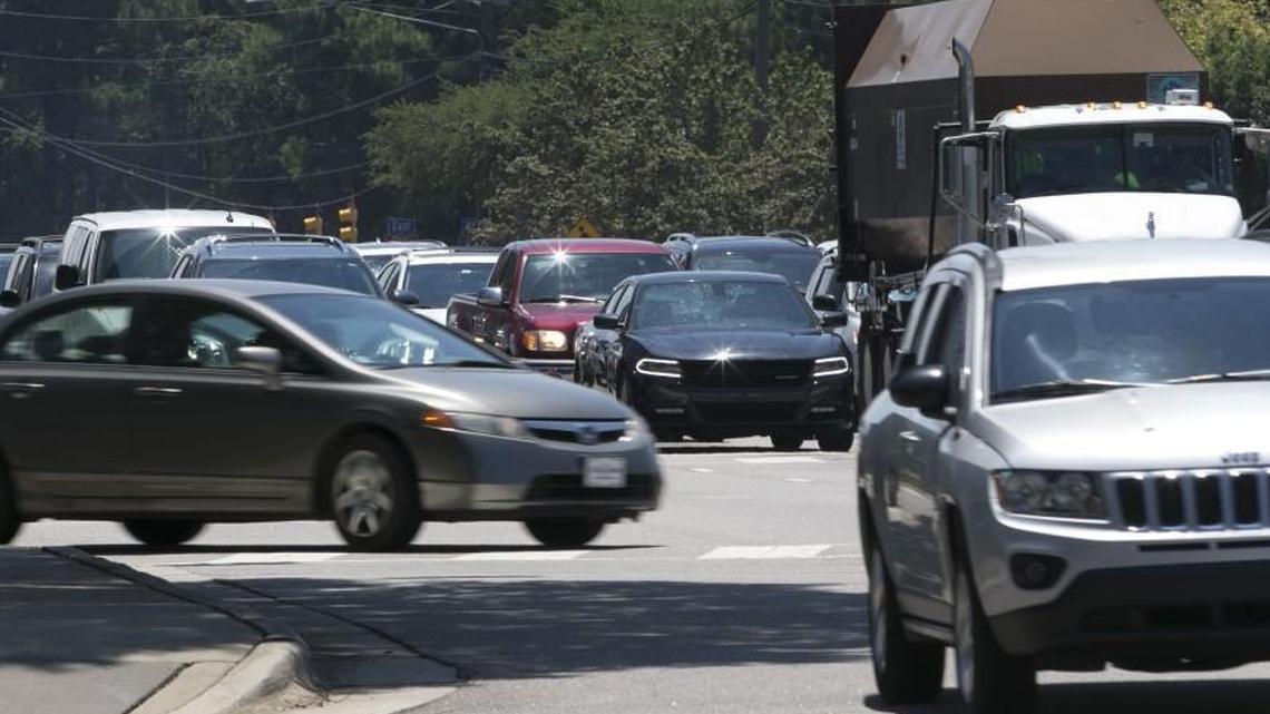Traffic congestion during the lunch hour on Six Forks Road at Dartmouth Road, at the entrance to North Hills in July.