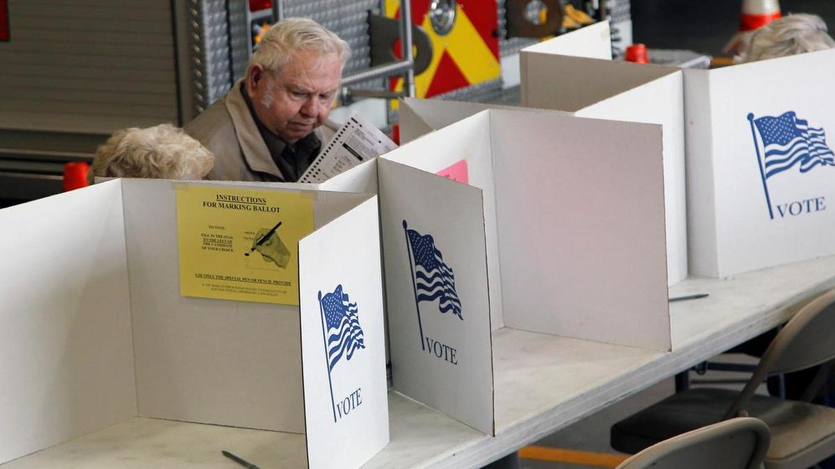 
Bill Bailey checks his ballot as he votes at Johnston County Precinct 10a at the Clayton Fire Station in Clayton on Nov. 5, 2014. 
