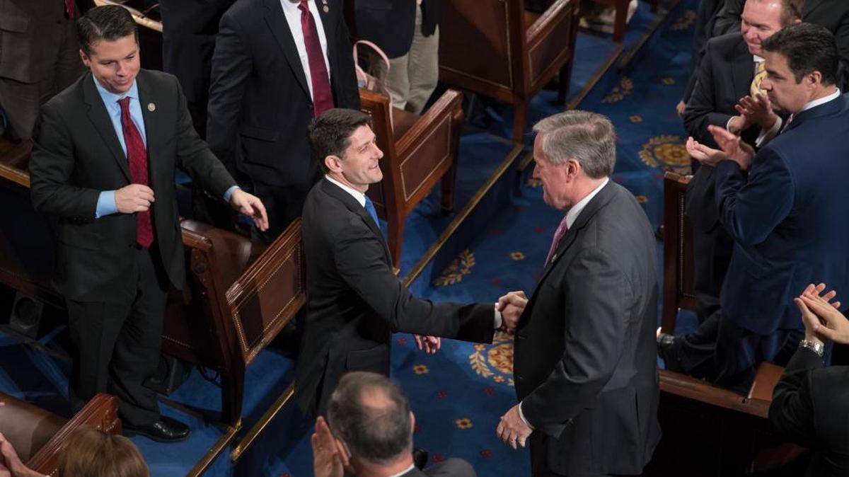 House Speaker Paul Ryan of Wis. shakes hands with Rep. Mark Meadows, R-N.C., right, as he is applauded following his re-election as speaker, during a ceremony in the House Chamber on Capitol Hill in Washington, Tuesday, Jan. 3, 2017.