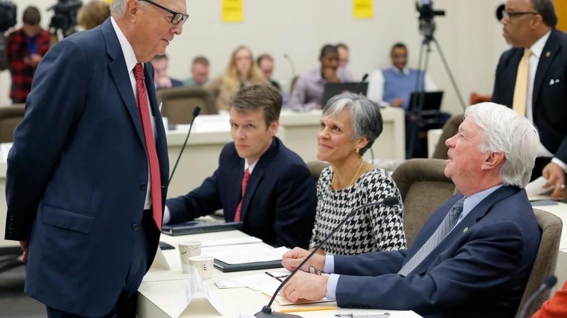 From left, then-Rep. Leo Daughtry talks with Thomas Shanahan, UNC senior vice president and general counsel, and UNC Board of Governors members Dr. Joan Perry and Lou Bissette before they speak to the Joint Legislative Commission on Governmental Operations in Raleigh on Nov. 18, 2015.