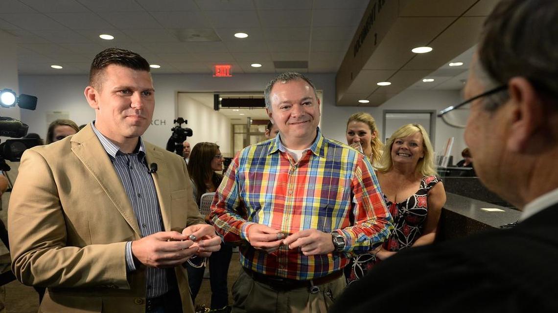 
Chad Biggs, left, and Chris Creech say their wedding vows in front of Wake County magistrate Dexter Williams in October. The N.C. House will consider a bill to exempt magistrates from performing weddings.
