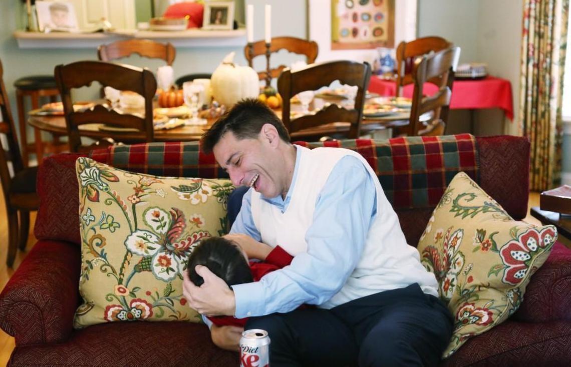 "You know what I am most thankful for?," Dallas Woodhouse, right, asks his youngest son, Cooper, 9, as they wrestle on the couch. "You!" he shouts before giving a squealing Cooper a kiss at Woodhouse's mother's Raleigh home on Thanksgiving, Nov. 23, 2017.