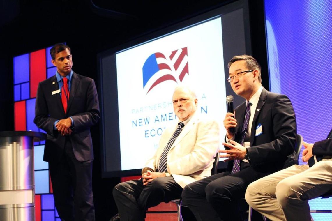 Morrisville Town Council member Steve Rao, far left, moderates a panel discussion on immigration reform June 8, 2014.