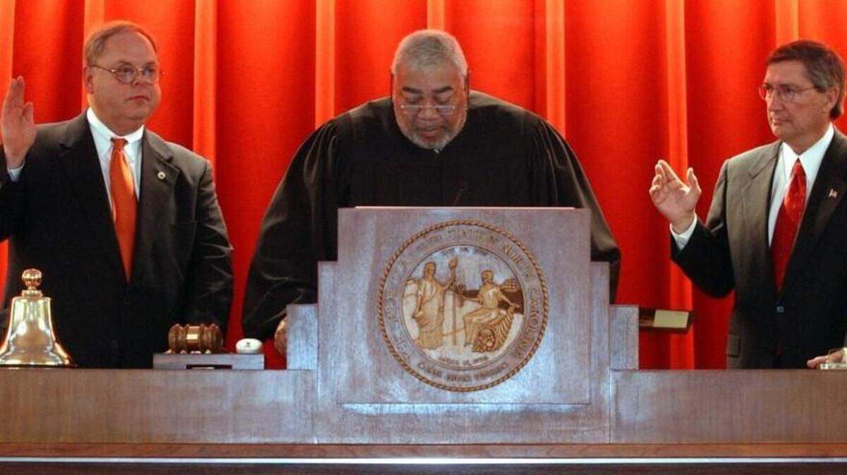 Rep. Richard Morgan, left, and Rep. Jim Black, right, take the oath of office as co-speakers of the North Carolina House of Representatives on Feb. 5, 2003.