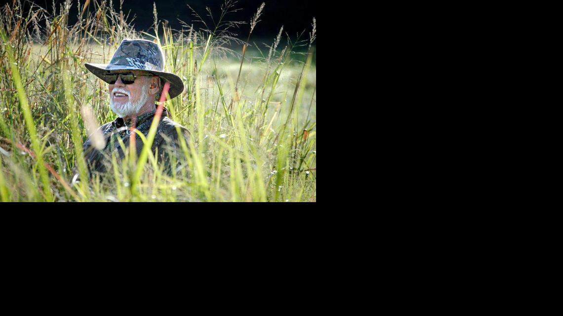 
Bob Walden of Mebane is hunkered down in weeds hunting for doves. An N.C. House bill would allow hunting on Sundays, which is currently illegal.
