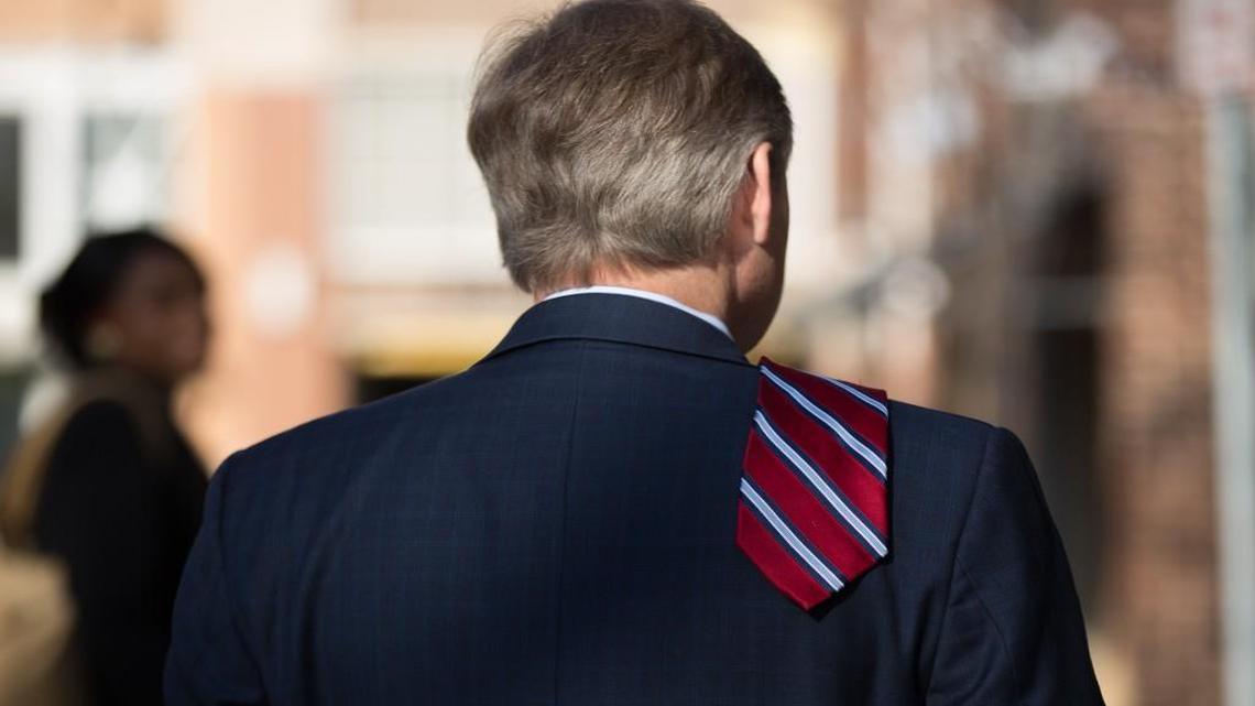 State Rep. Duane Hall waits outside of Market Hall prior to former president Bill Clinton's arrival for a Hillary Clinton for North Carolina campaign event on March 7, 2016 in Raleigh. Hall hasn’t publicly responded the request of Democratic Party leaders that he resign after misconduct allegations surfaced on Feb. 28, 2018.