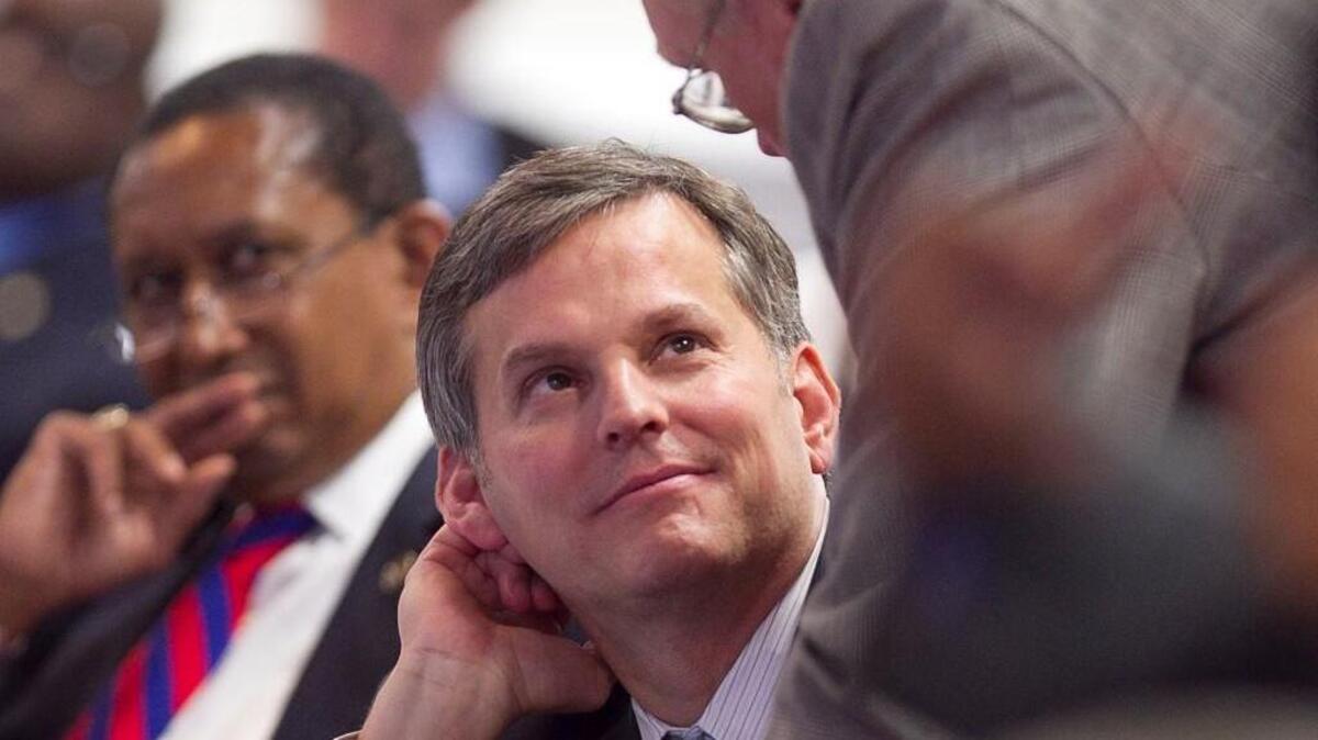 Senator Josh Stein of Wake County, center, listens to Senator Jerry W. Tillman of Archdale, N.C. during debate of HB 1050, Omnibus Tax Law Changes, in the North Carolina State Senate on Wednesday, May 28, 2014, in Raleigh.