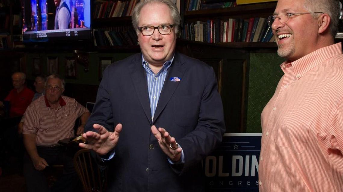 Congressman George Holding talks with Duane Cutlip upon his arrival on June 7, 2016, at the Hibernian in Raleigh, N.C.