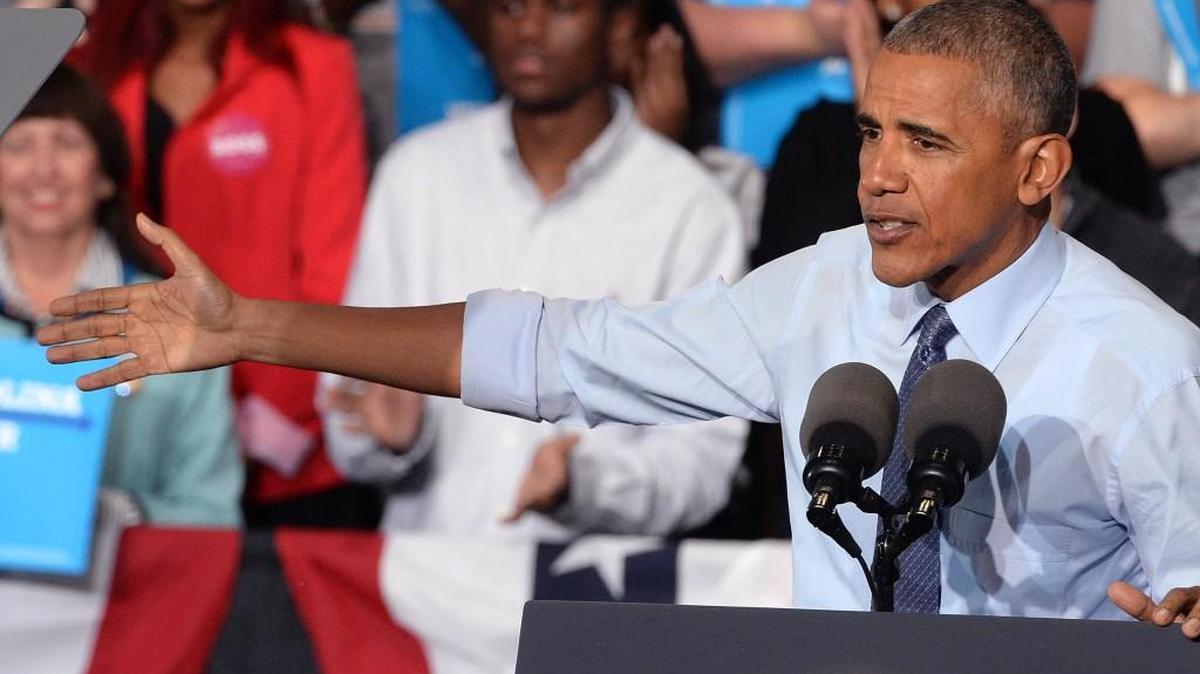 President Barack Obama speaks to the crowd as he stumps for Hillary Clinton in Greensboro Tuesday, Oct. 11, 2016.