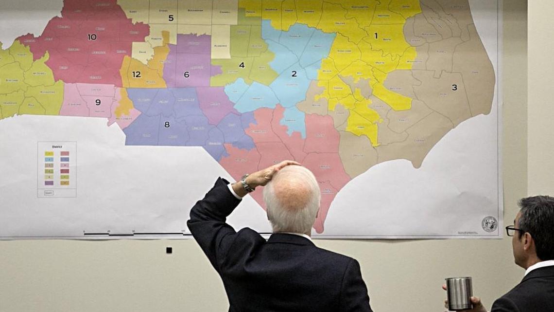 Joint Select Committee on Congressional Redistricting members review historical voting maps during a meeting at the N.C. legislature in February.