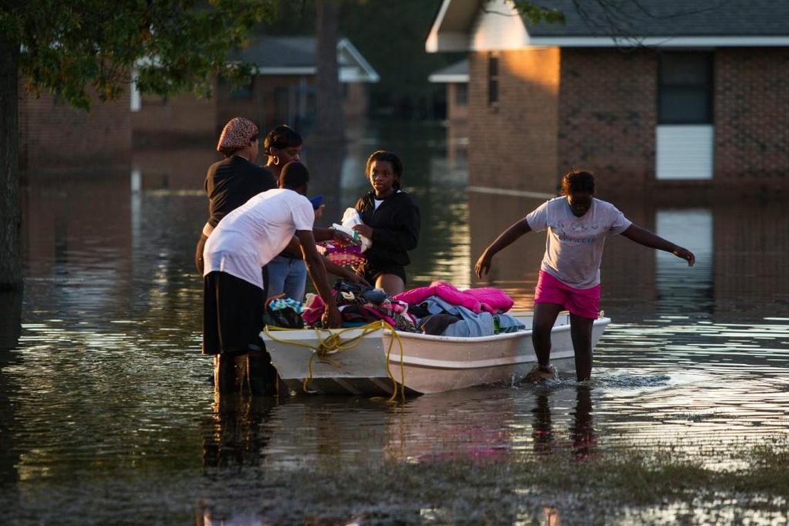 Residents return from checking their homes after Hurricane Matthew, which downed trees and caused power and water outages and widespread flooding in Lumberton. The storm was a Category 1 but killed 25 people in North Carolina in October 2016.