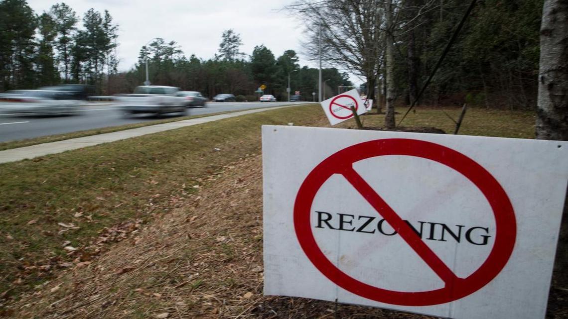 
Signs opposing a rezoning change to allow a Publix grocery store line Falls of Neuse Road in January. The state Senate voted Thursday to abolish the procedure neighbors used to stop the store, known as a protest petition.
