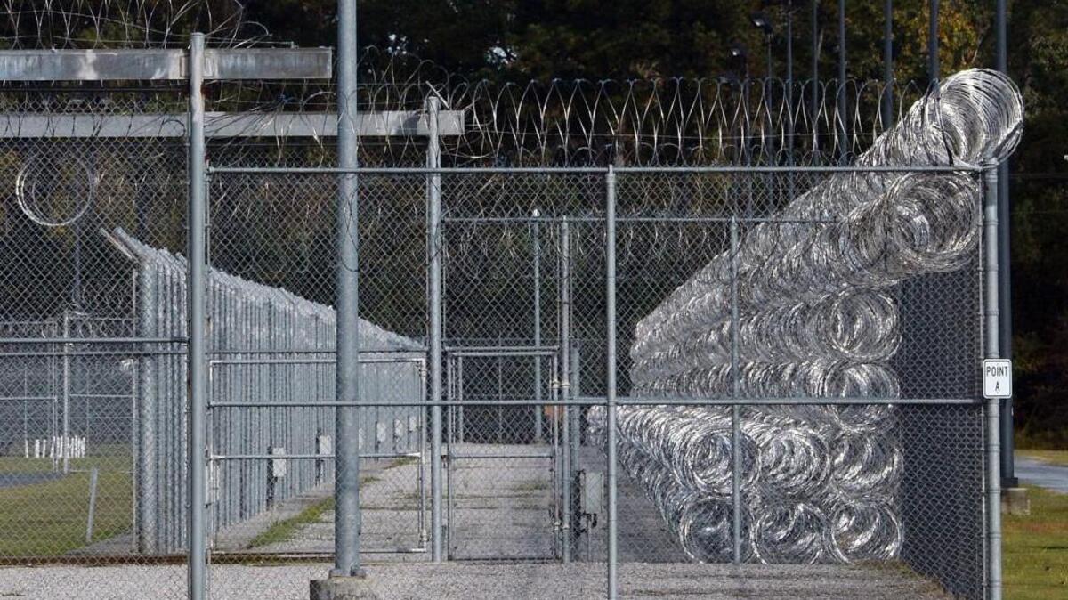 Fences surround Maury Correctional Institution in Hookerton. Judge Reuben Young has been named as interim chief of the N.C. prison system.