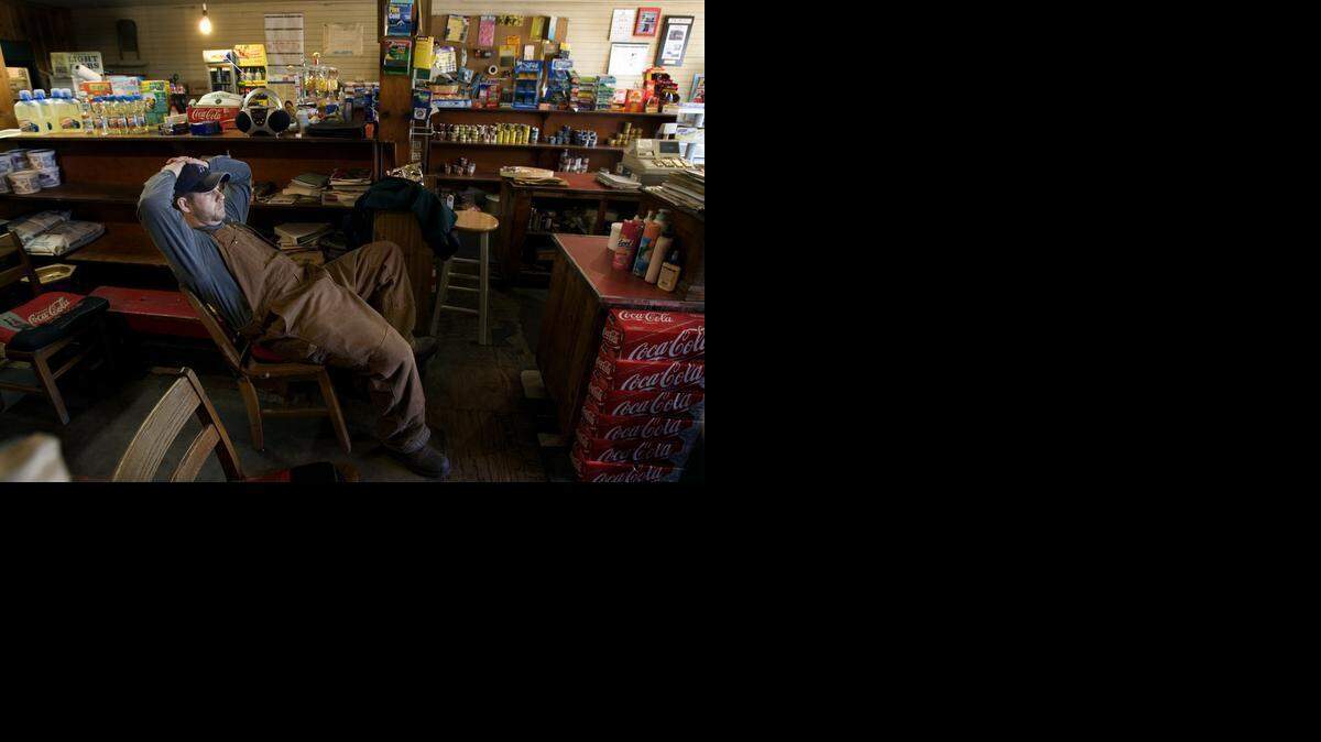 
Josh Barnes relaxes at the C. E. Barnes Store in Archer Lodge. A bill that cleared a Senate committee Tuesday aims to allow country stores to install tables and chairs, even if they don’t qualify as a restaurant.
