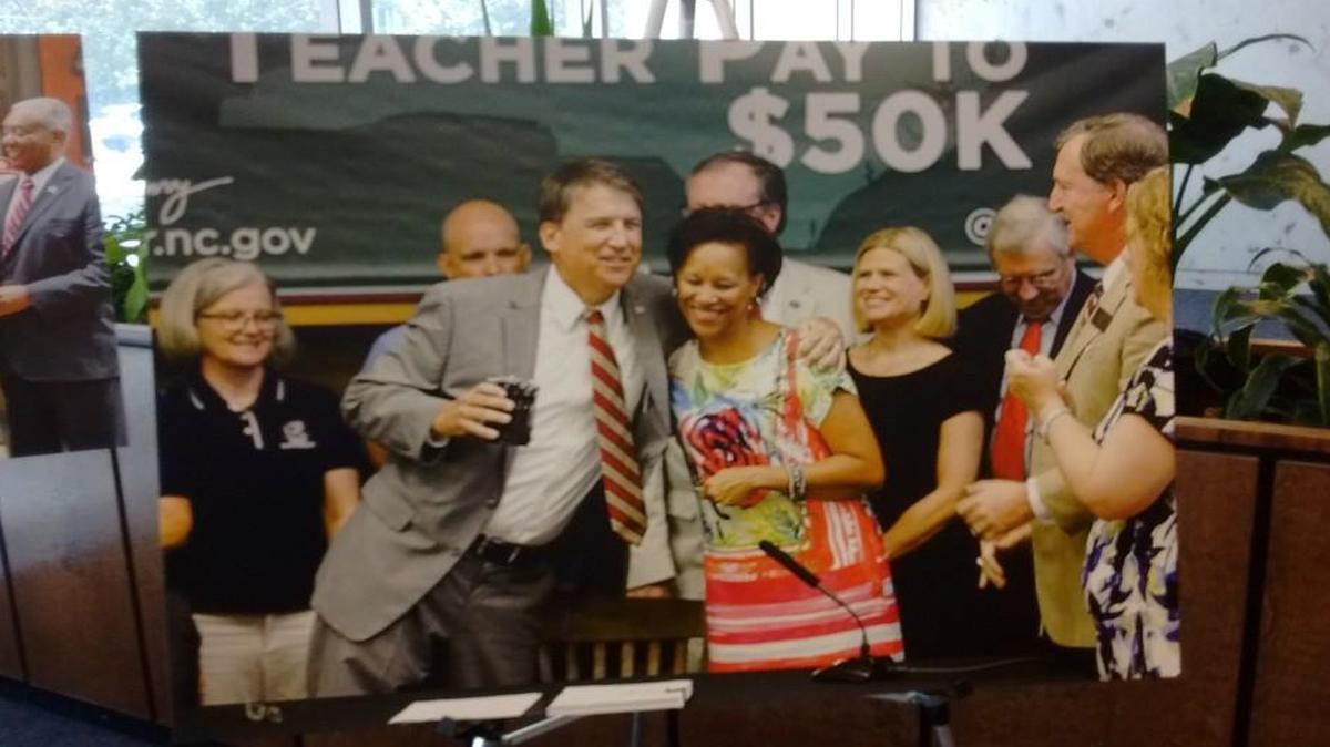 The N.C. Democratic Party is criticizing this poster of Gov. Pat McCrory and a slogan about teacher pay in the lobby of the Administration Building.