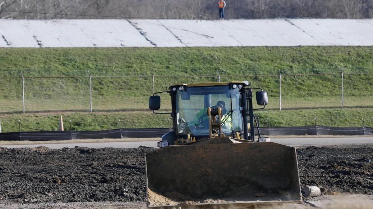 In this Thursday, Jan. 14, 2016, photo, heavy equipment is in use while coal ash cleanup is underway at the Dan River Steam Station in Eden, N.C. Duke Energy Corp. is digging up and hauling away the toxic coal residues two years after one of the worst coal-ash spills in U.S. history.