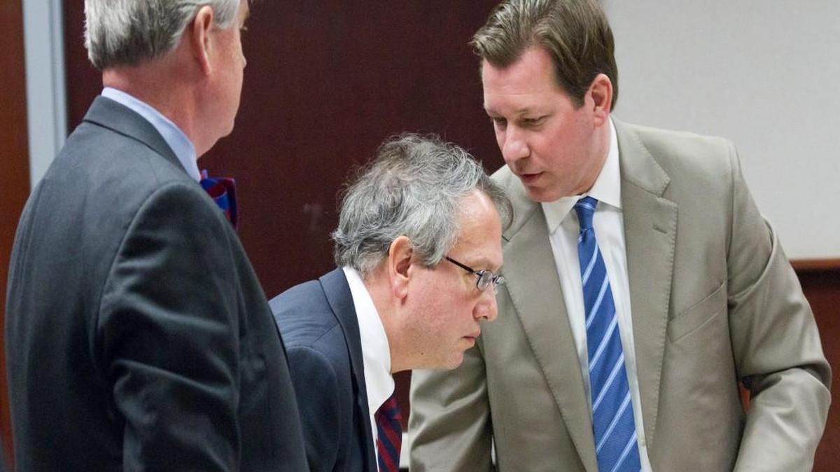 Thomas Farr, center, confers with Alexander McC. Peters, left and Phil Strach, right, during a break in state court where they defended GOP lawmakers on a challenge to the now-defunct Voter ID law. Farr was nominated on Thursday, July 13, 2017, by President Donald Trump to fill a federal judge post in the Eastern District of NC.