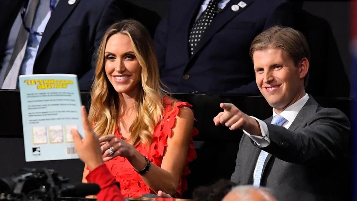 Donald Trump’s son Eric Trump, right and wife Lara interact with the crowd during the second day of the Republican National Convention in Cleveland, Tuesday, July 19, 2016.